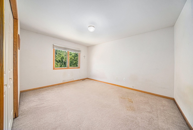 unfurnished room with carpet flooring