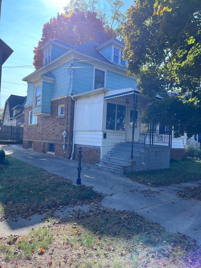 view of side of home with a patio area