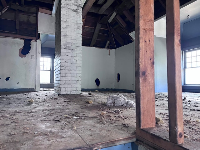 interior space with plenty of natural light and lofted ceiling