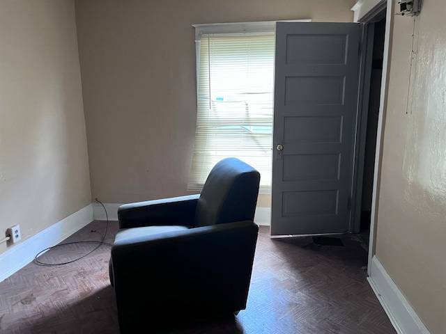 living area featuring dark parquet floors