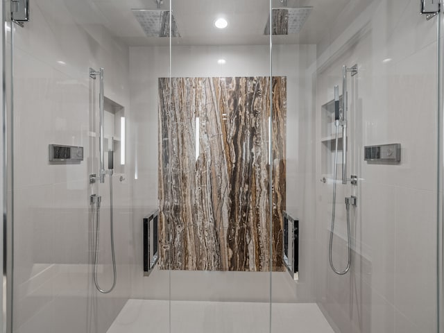 bathroom with a shower with shower door