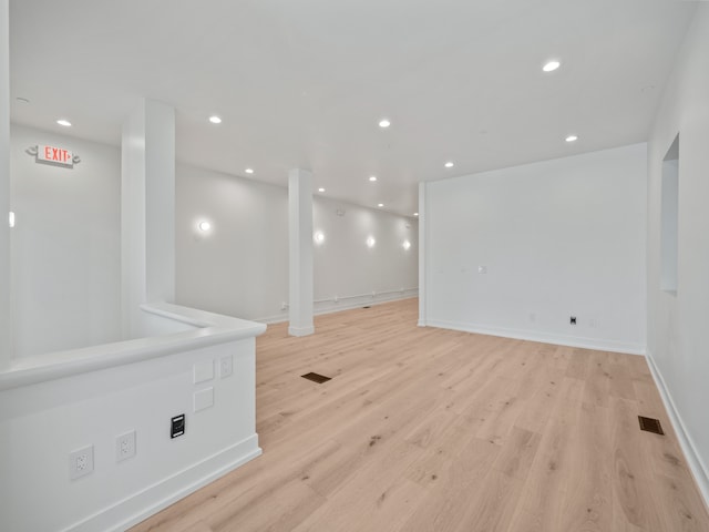 empty room with light hardwood / wood-style floors