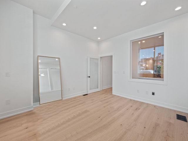 unfurnished bedroom featuring light wood-type flooring