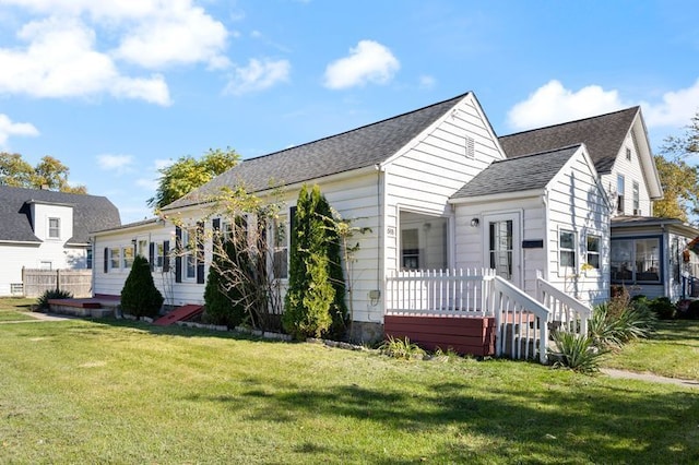 back of house featuring a yard