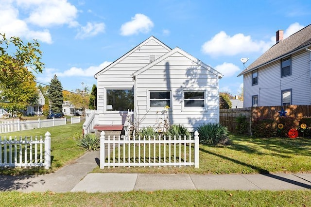 bungalow-style house featuring a front yard