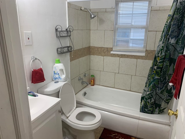 full bathroom featuring vanity, shower / bath combo, and toilet