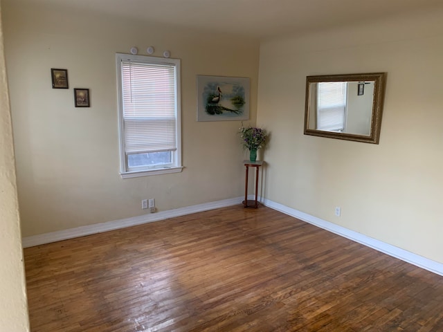 empty room featuring dark hardwood / wood-style flooring