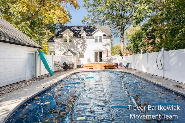 view of swimming pool with a wooden deck