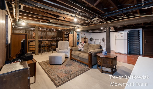 basement featuring white refrigerator