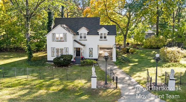 view of front of home with a garage and a front yard