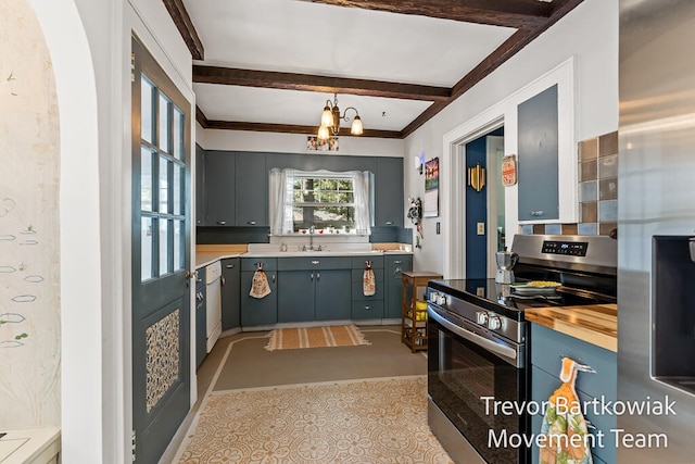 kitchen with appliances with stainless steel finishes, sink, decorative light fixtures, beamed ceiling, and a chandelier