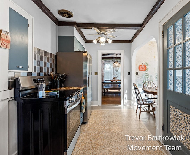 kitchen featuring stainless steel range with gas cooktop, ceiling fan, ornamental molding, tasteful backsplash, and beam ceiling