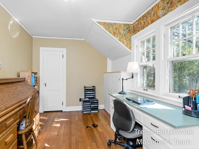 office area featuring wood-type flooring, vaulted ceiling, plenty of natural light, and crown molding