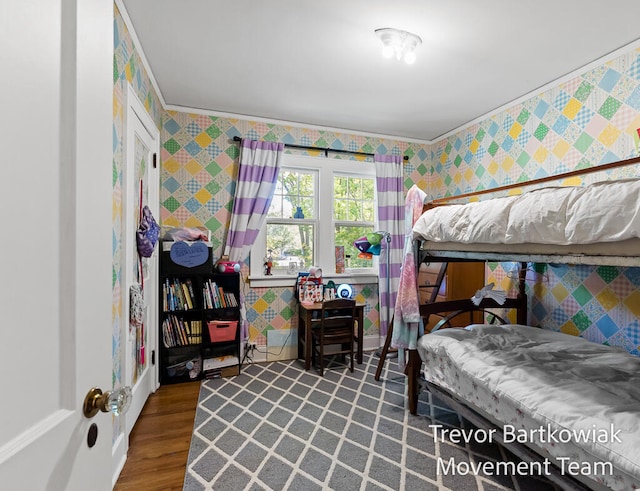 bedroom with hardwood / wood-style floors