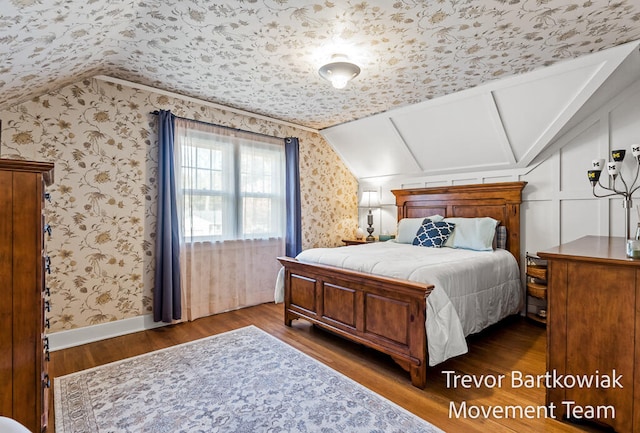 bedroom featuring dark hardwood / wood-style floors and vaulted ceiling