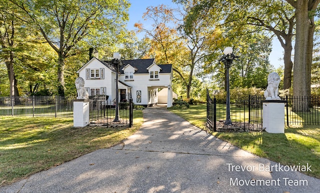 view of front of property featuring a front yard and a garage