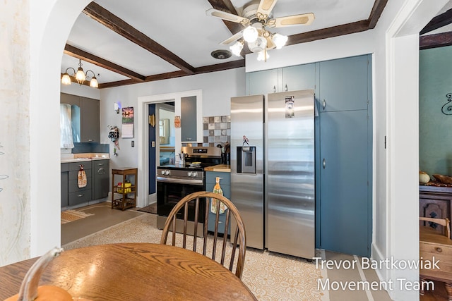 dining space featuring beamed ceiling, ceiling fan, and crown molding