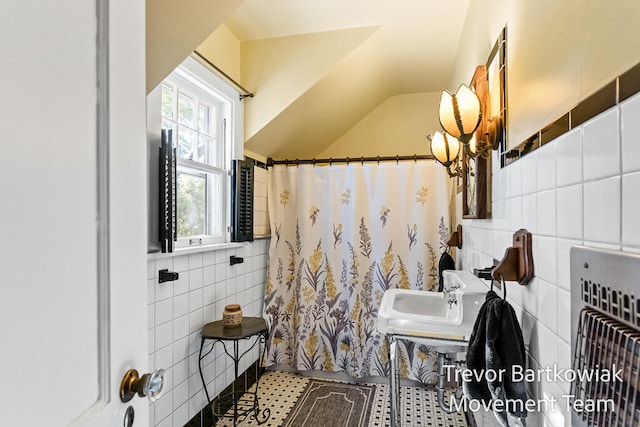 bathroom featuring sink, tile patterned flooring, a shower with shower curtain, tile walls, and heating unit