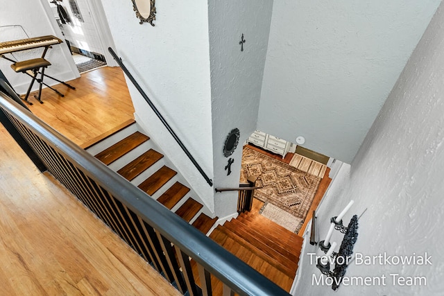 stairway featuring hardwood / wood-style floors