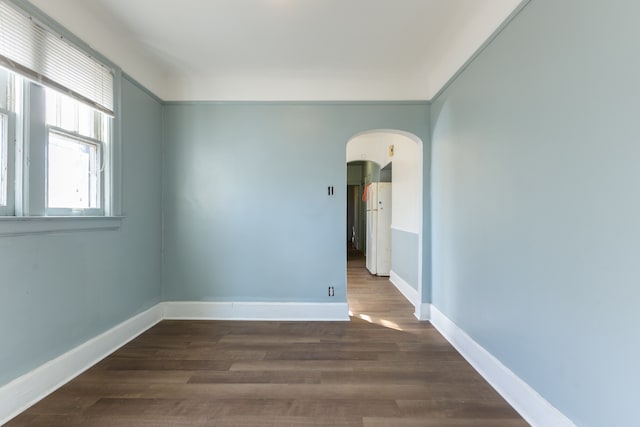 unfurnished room featuring dark hardwood / wood-style floors