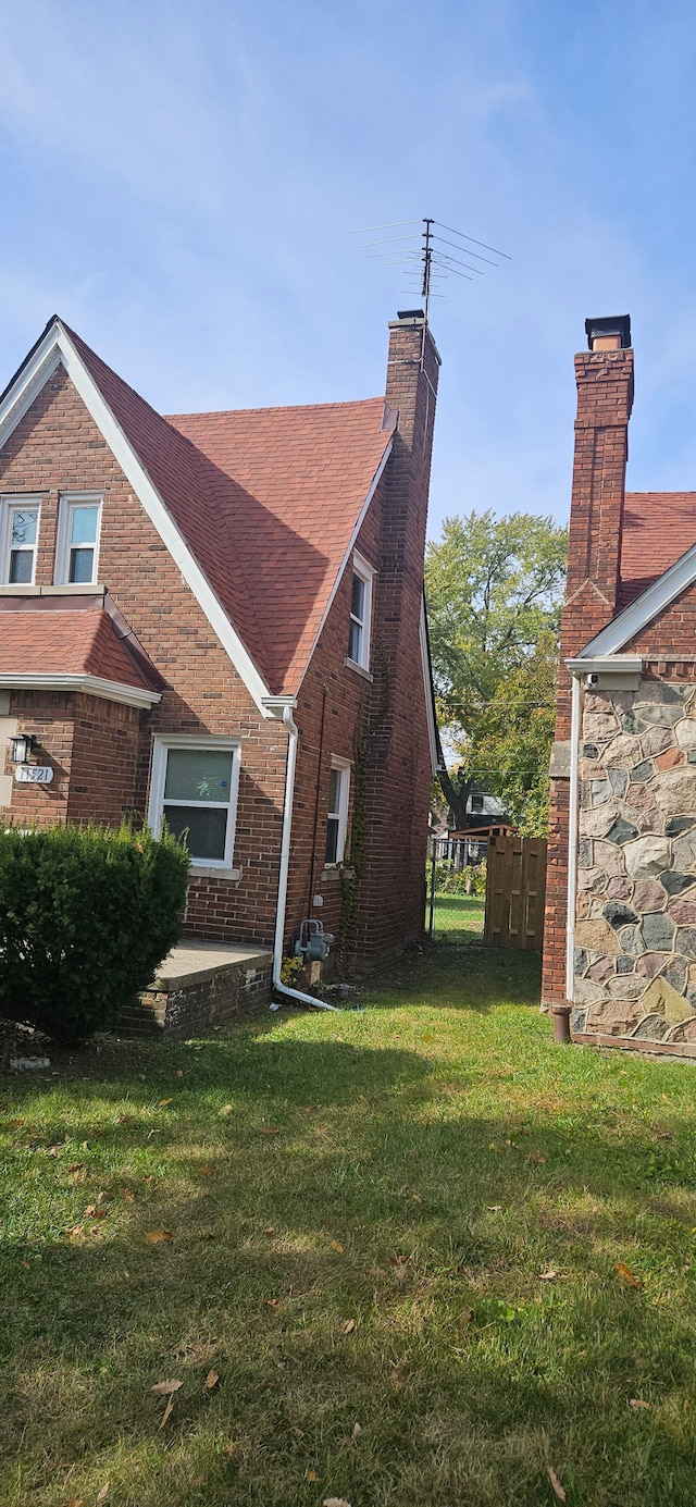 view of property exterior featuring a lawn