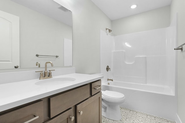 full bathroom with tile patterned floors, washtub / shower combination, vanity, and toilet