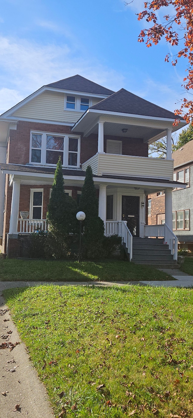 3937 Beniteau St, Detroit, MI 48214 - view of front of property with covered porch, a balcony, and a front lawn