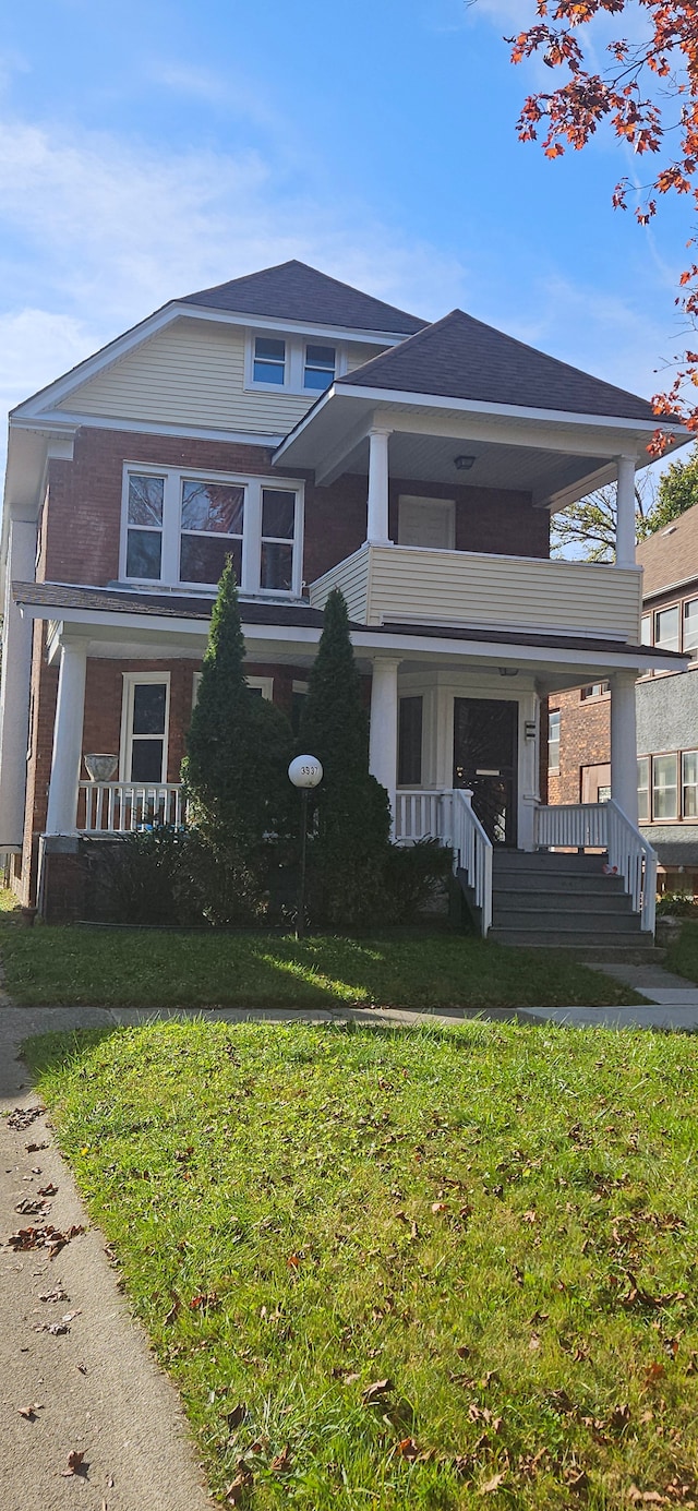3937 Beniteau St, Detroit, MI 48214 - view of front of home featuring a porch, a front yard, and a balcony