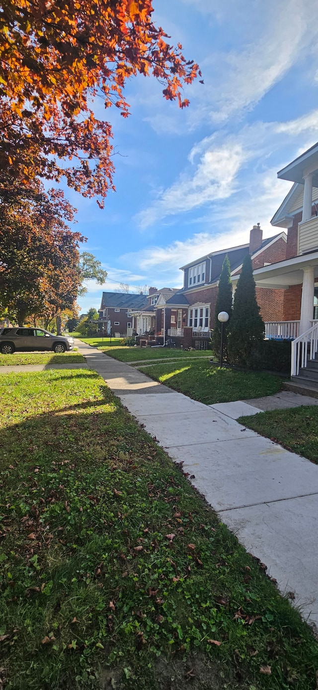 3937 Beniteau St, Detroit, MI 48214 - surrounding community featuring a lawn and a residential view