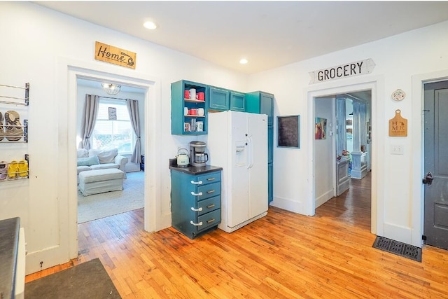 hallway with light hardwood / wood-style flooring