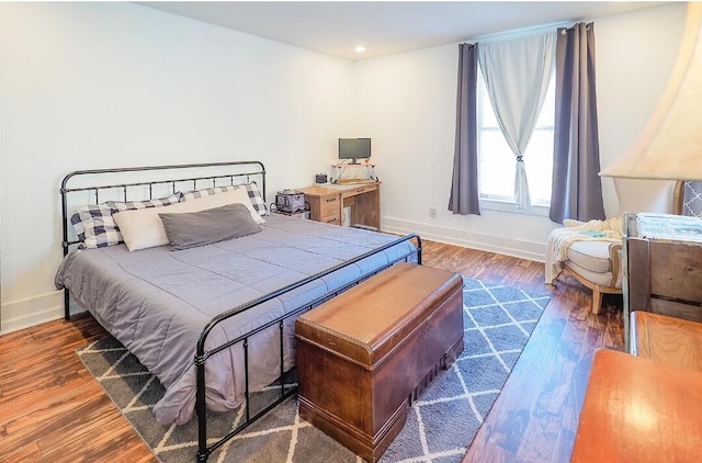 bedroom with dark wood-type flooring