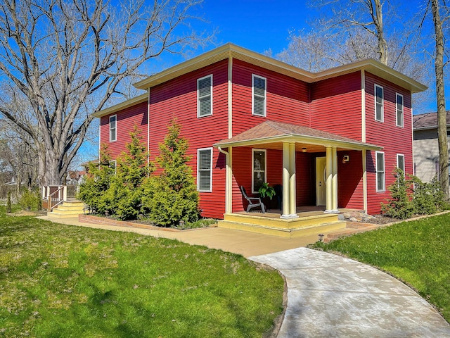 view of front facade with a porch and a front lawn