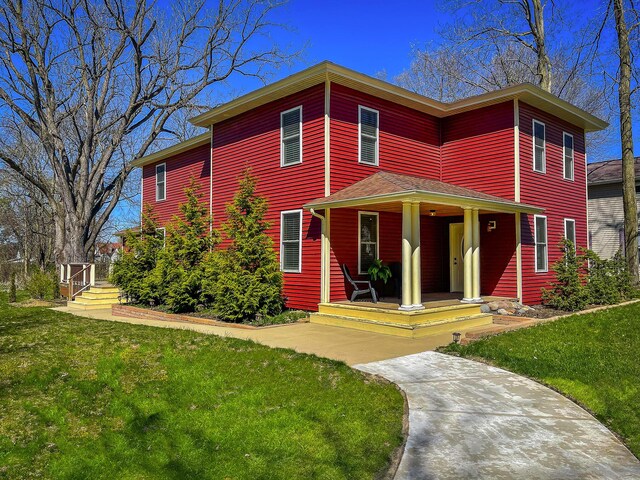 620 S Main St, Wayland, MI 49348 - view of front of home featuring a porch and a front lawn