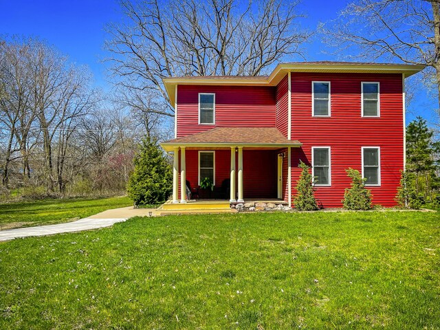 620 S Main St, Wayland, MI 49348 - view of front facade with covered porch and a front lawn