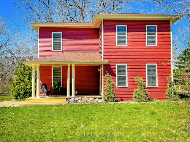 view of front of property with a front lawn and a porch