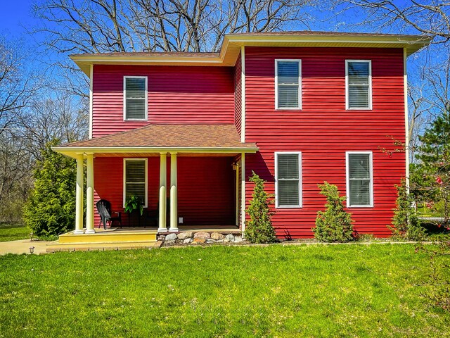620 S Main St, Wayland, MI 49348 - view of front of house featuring a front lawn and a porch