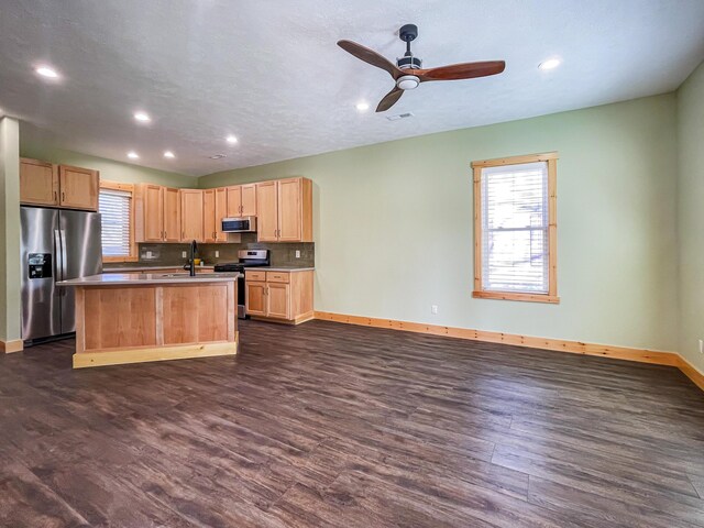 620 S Main St, Wayland, MI 49348 - kitchen with appliances with stainless steel finishes, light brown cabinetry, baseboards, dark wood-type flooring, and recessed lighting