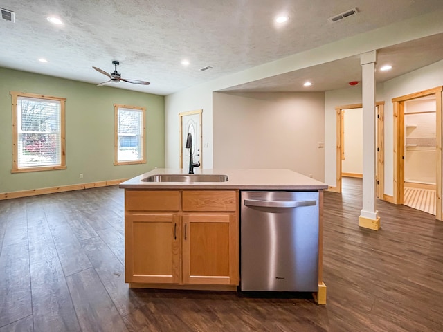 kitchen with sink, stainless steel dishwasher, ceiling fan, an island with sink, and dark hardwood / wood-style flooring