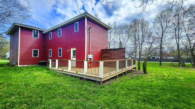 620 S Main St, Wayland, MI 49348 - back of property with a deck, a yard, and central AC