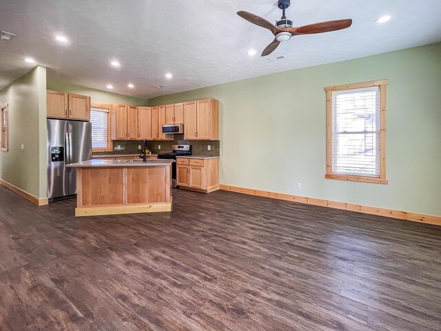 620 S Main St, Wayland, MI 49348 - kitchen with stainless steel appliances, light brown cabinetry, baseboards, dark wood-type flooring, and recessed lighting