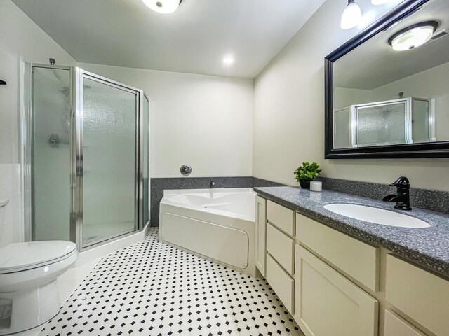 620 S Main St, Wayland, MI 49348 - bathroom with vanity, a shower stall, toilet, and a garden tub