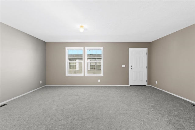 unfurnished room with carpet flooring