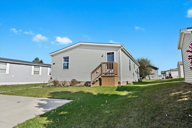 back of house featuring a yard