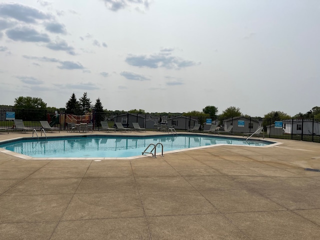 view of swimming pool featuring a patio area