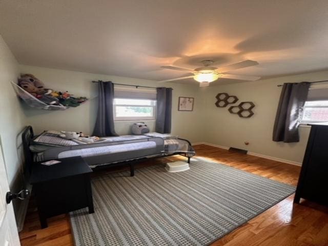 bedroom featuring hardwood / wood-style flooring and ceiling fan