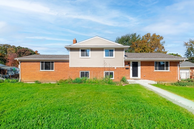 tri-level home featuring a front yard