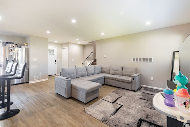 living room with light hardwood / wood-style flooring