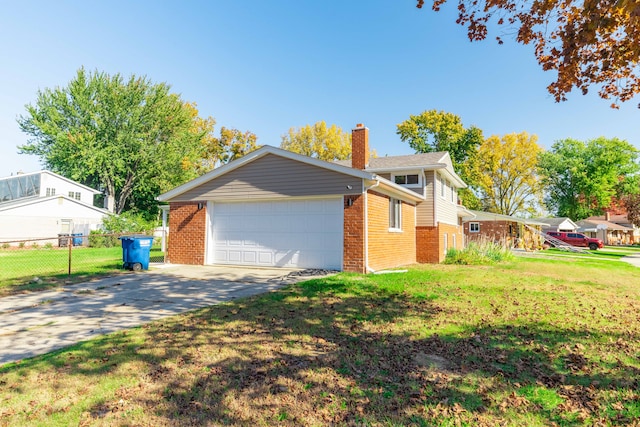 exterior space featuring a garage and a lawn