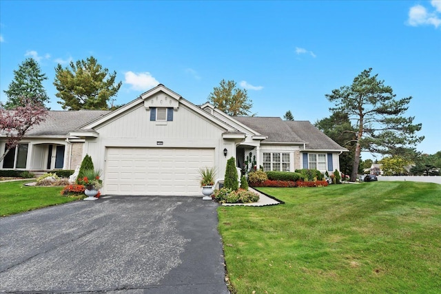 view of front facade with a garage and a front yard