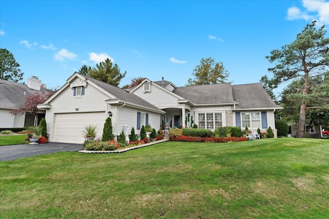 view of front facade featuring a front yard and a garage